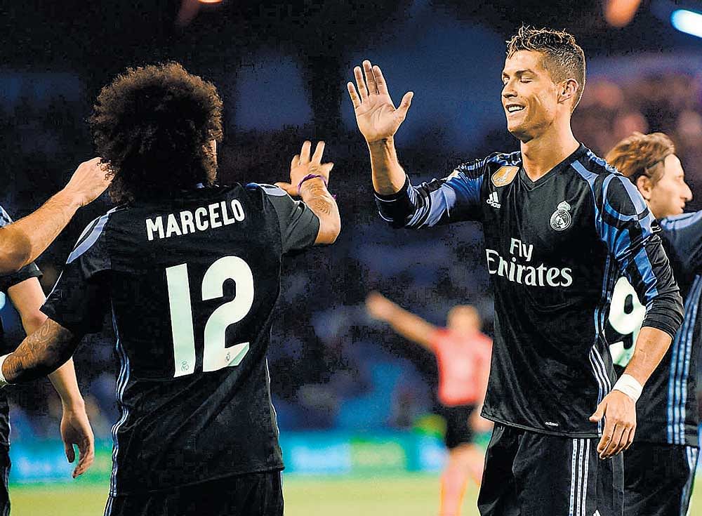 Real Madrid's Cristiano Ronaldo (right) celebrates his goal on Wednesday. AFP