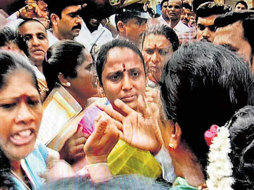 Women, said to be supporters of MLA&#8200;Munirathna. DH File Photo