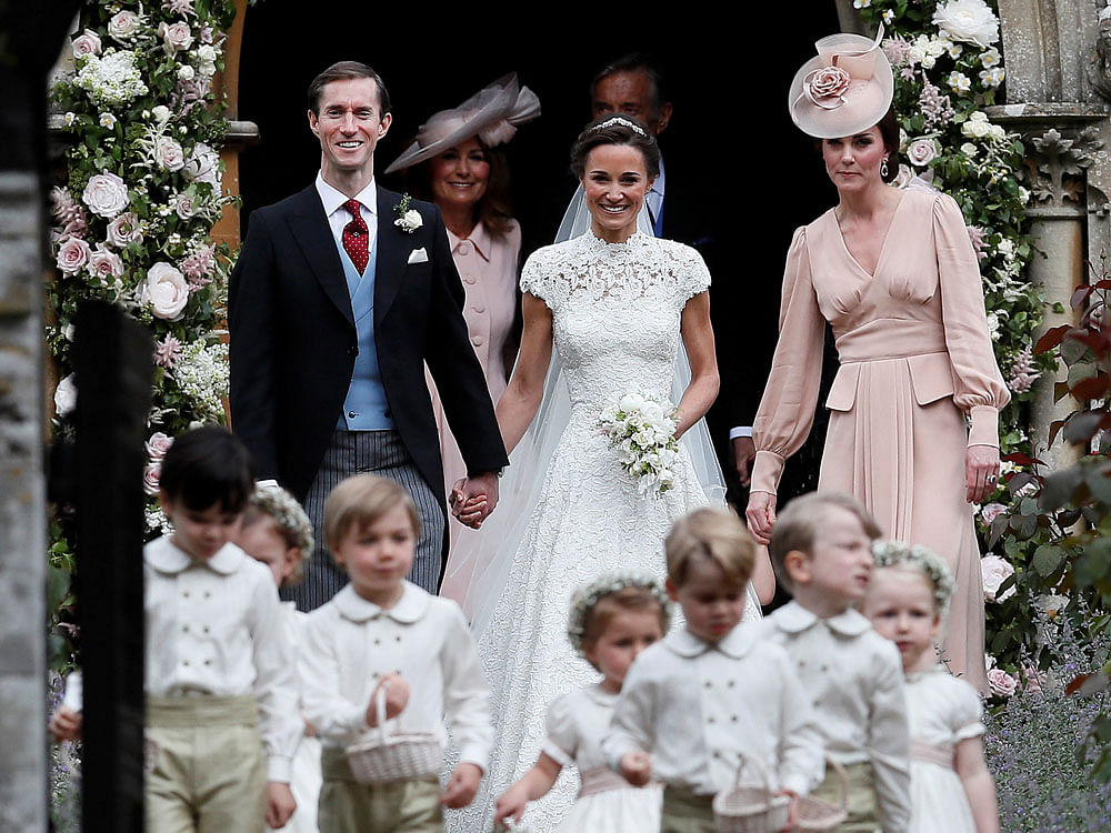 Pippa Middleton with her husband Matthews and sister Kate Williams. Photo credit: Reuters.