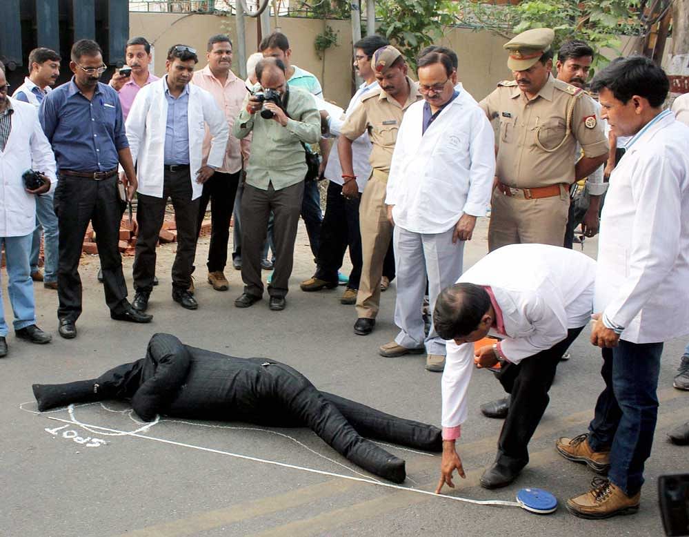UP forensic team during recreation of crime scene of IAS Anurag Tiwari's mysterious death case in Lucknow on Saturday. PTI Photo