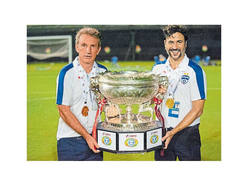Deserving: BFC coach Albert Roca (left) and assistant coach Carles Cuadrat with the Federation Cup. BFC Media