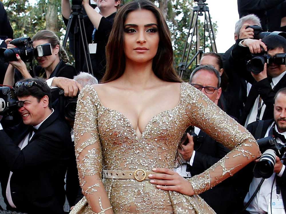Sonam styled her look with a sleek, centre-parted hair, shimmery gold smokey eyes, Reuters Photo