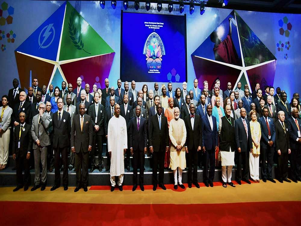 Prime Minister Narendra Modi with foreign dignitaries at the 52nd African Development Bank's annual meeting in Gandhinagar, Gujarat on Tuesday. PTI Photo