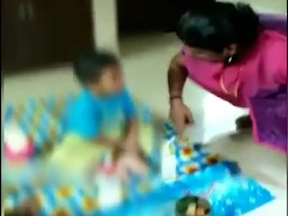 In the video, the centre owner is seen asking, animatedly, the child sitting on a mat why he had taken what appears to be a packet of juice. Mini goes on to hit the boy on his arm and leg and talks to the child in a threatening tone. Screen grab
