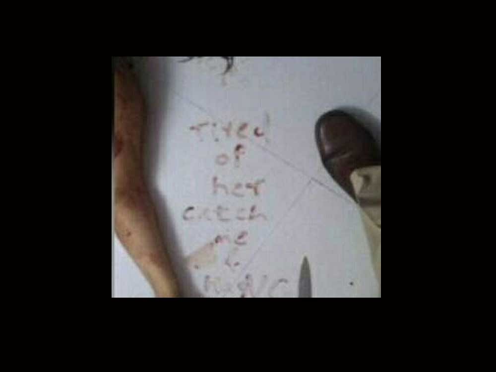 A note 'tired of her, catch and hang me' - was found written in blood on the floor where the wife of the police officer - who probed the Sheena Border murder case - was stabbed to death at their flat in Santacruz West area of Mumbai on Wednesday. Deccan Herald photo