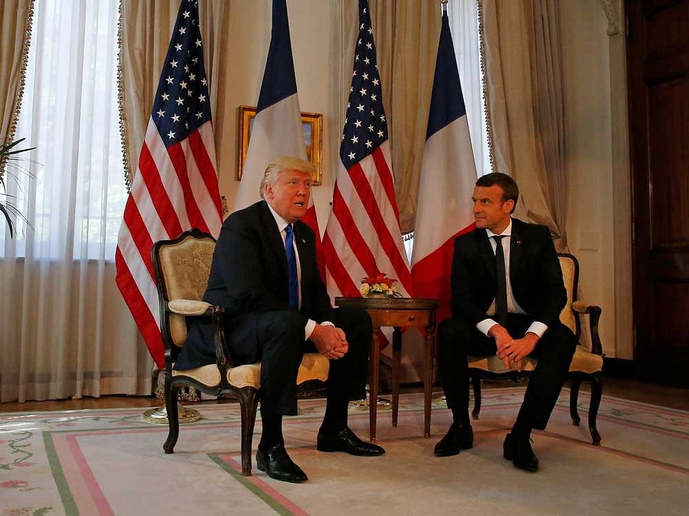 U.S. President Donald Trump (L) meets French President Emmanuel Macron before a working lunch ahead of a NATO Summit in Brussels, Belgium, May 25, 2017. Reuters photo.