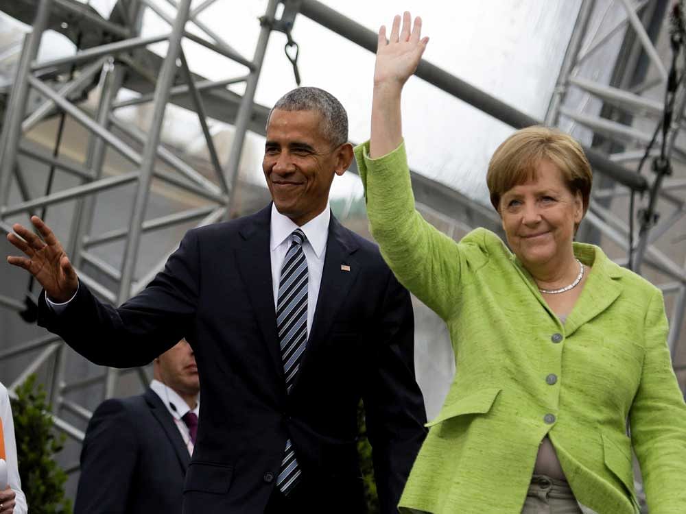 Former U.S. President Barack Obama, left, and German Chancellor Angela Merkel, right, arrive for a discussion event on democracy and global responsibility at a Protestant conference in Berlin, Germany, Thursday, May 25, 2017, when Germany marks the 500th anniversary of the Reformation.AP/PTI Photo