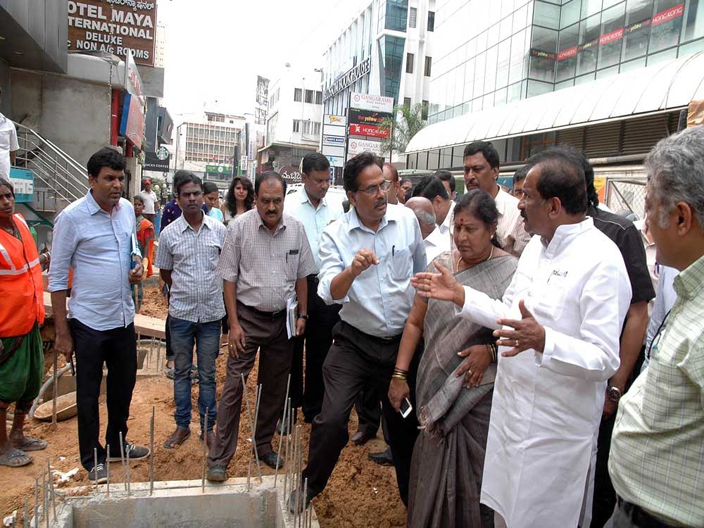 Following complaints about the snail pace of work, George accompanied by Mayor G Padmavathi, BBMP commissioner N Manjunatha Prasad and other Palike officers visited Church Street. DH photo
