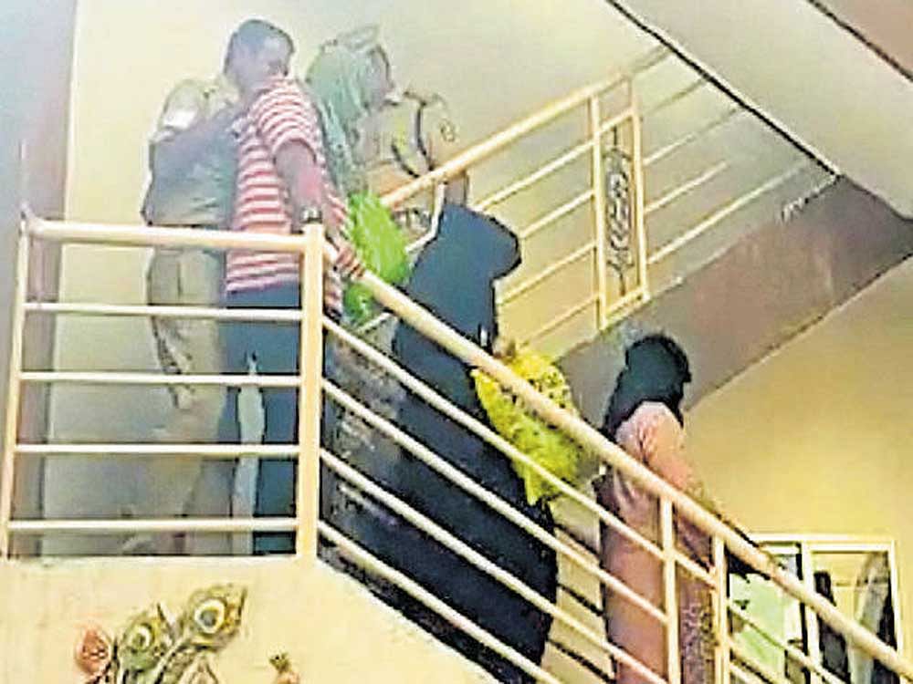 A video grab of three Pakistani nationals and an Indian  being arrested from their house in Kumaraswamy Layout  on Wednesday.