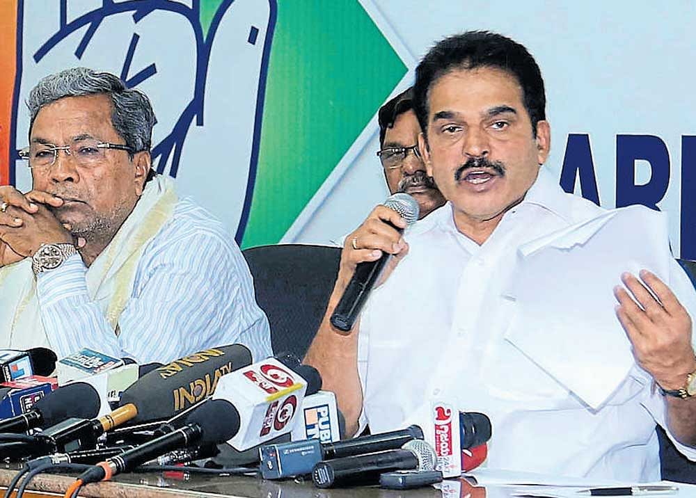 AICC general secretary in charge of Karnataka K C Venugopal addresses the media in  Bengaluru on Friday. Chief Minister Siddaramaiah is seen. DH photo