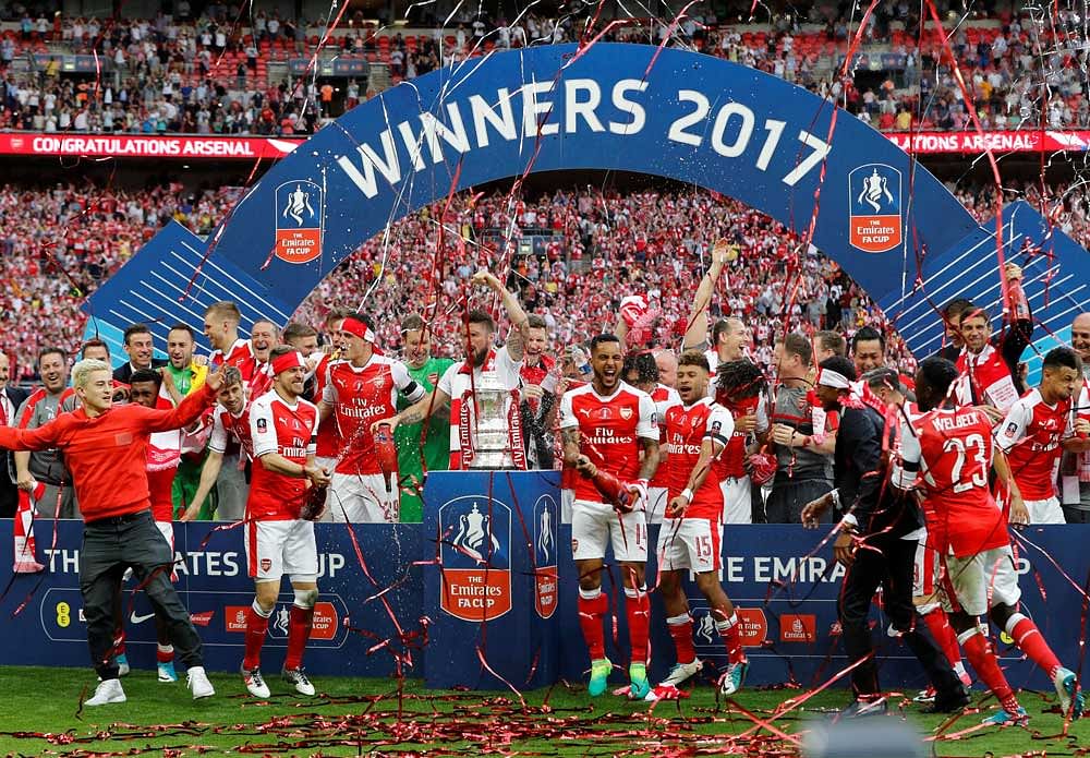 Arsenal have now won the FA Cup a record 13 times while Wenger is now the most successful manager in the competition's history having secured the trophy seven times. Reuters photo.