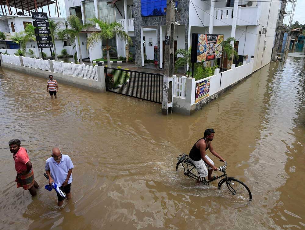 Over 170 people have lost their lives in the torrential rain and the ensuing floods in Sri Lanka. Photo credit: AP/PTI.