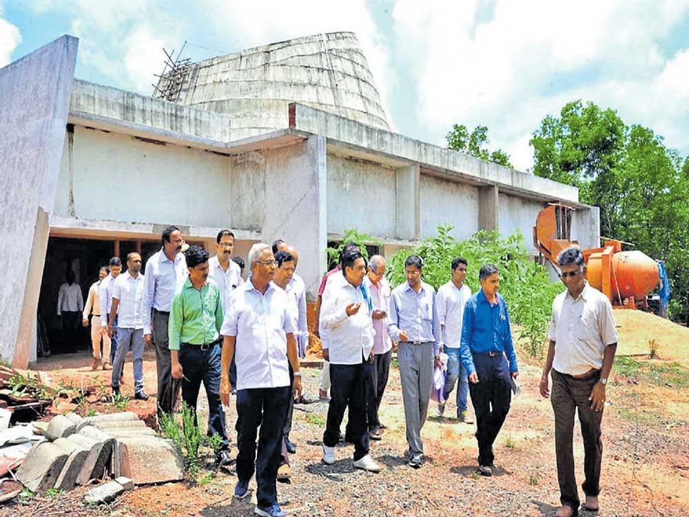 Planning, Statistics, Science and Technology Minister M R Seetharam inspects 3D planetarium construction work at Pilikula Nisargadhama on Monday. Mangaluru South MLA J R Lobo and science and technology department Director Dr H Honnegowda look on.