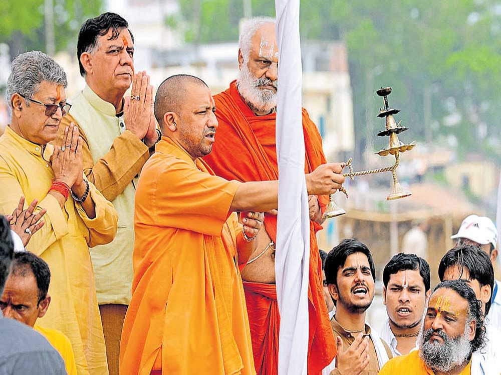 Uttar Pradesh Chief Minister Yogi Adityanath performs 'aarti' on the banks of river Saryu in Ayodhya on  Wednesday. Reuters