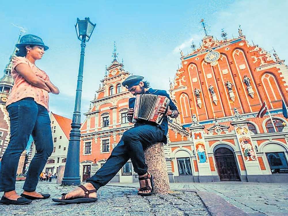 Travel destinations and adventure activities are increasingly being influenced by social media. (Above)&#8200;Saurav Arya with his wife at Riga, Latvia.