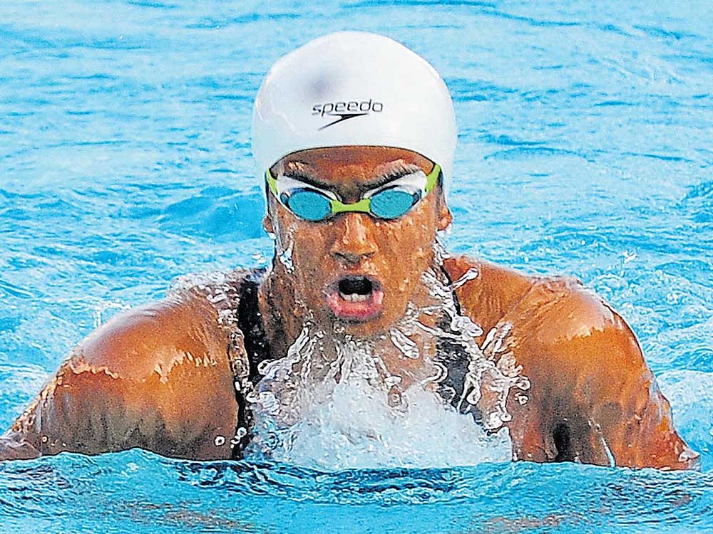 Riddhi Bohra of Pooja Aquatic Center en route to her gold medal in the Group I, 50M breaststroke on Thursday. dh Photo