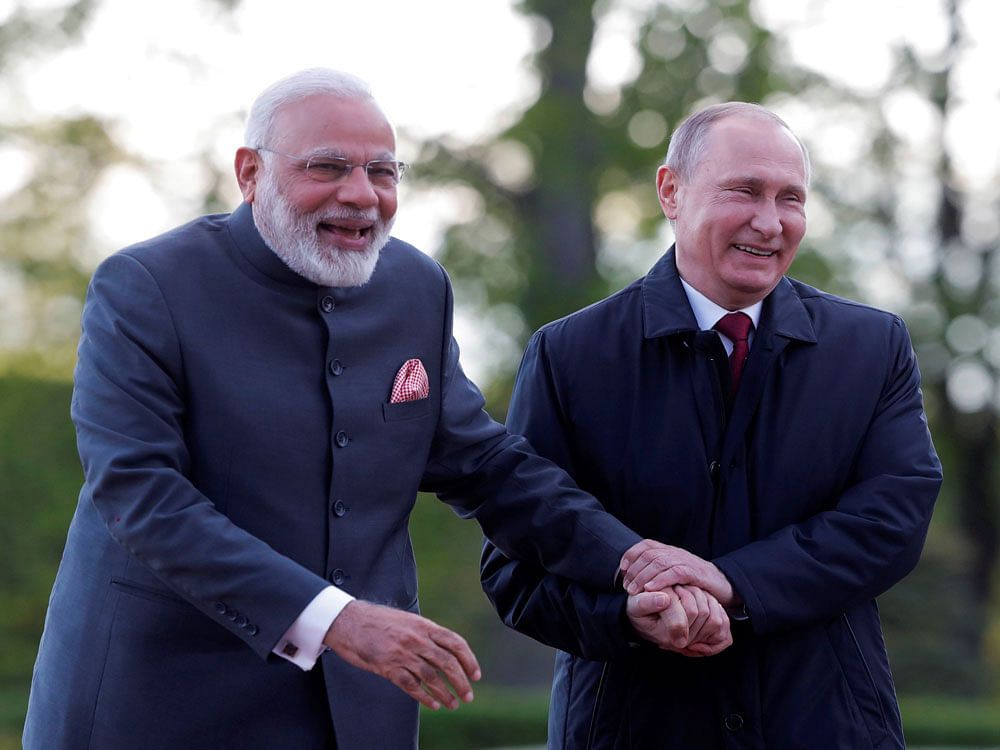 Narendra Modi and Vladimir Putin discussed the economic ties in their meeting, stressing on the importance of bilateral trade between India and Russia. Photo credit: reuters.