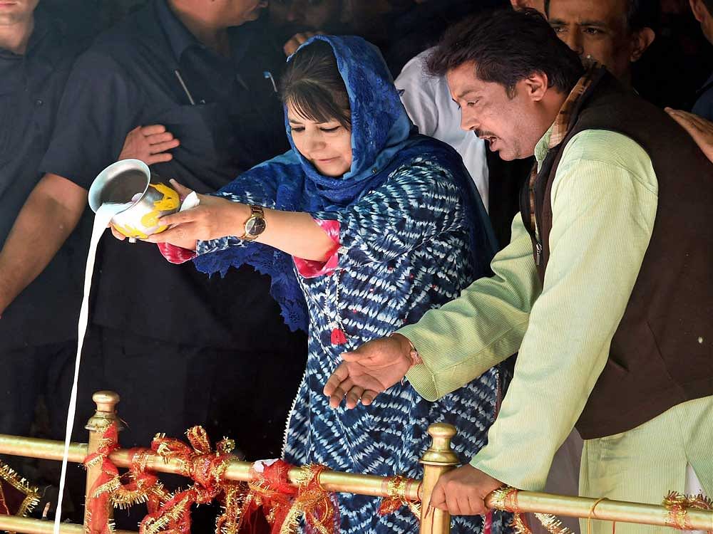 Jammu and Kashmiri chief minister Mehbooba Mufti at the famous Kheer Bhawani temple on the occasion of annual Mela at Tulmullah in Ganderbal district on Friday. Thousands of Hindu devotees, including migrant Kashmiri pandits, visited the shrine and paid their obeisance. PTI Photo