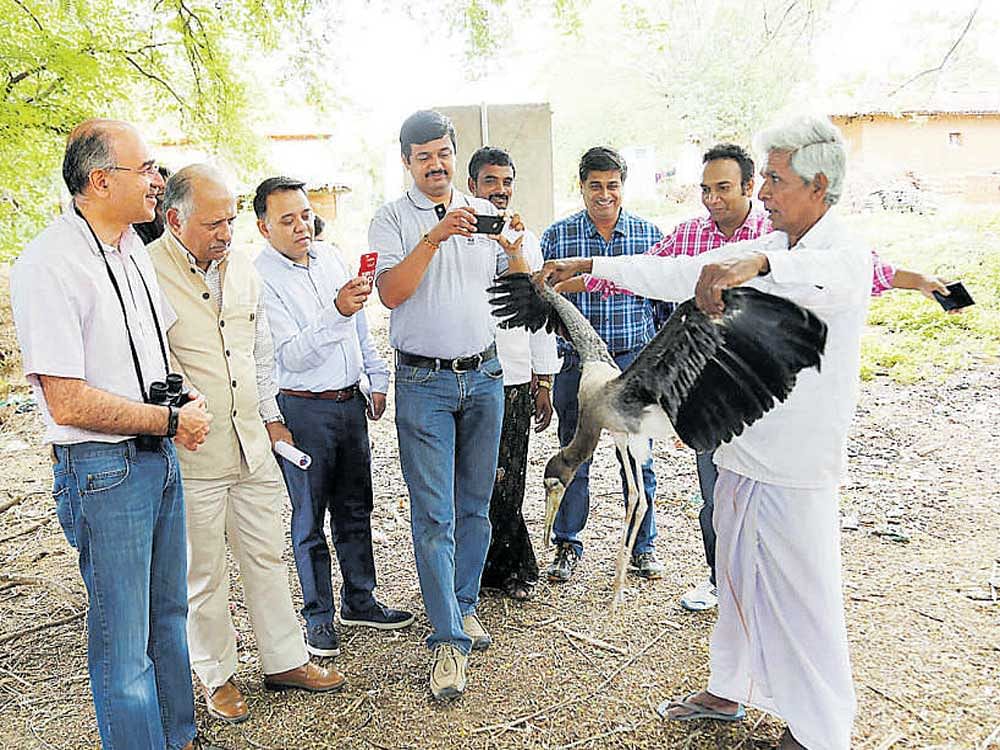(From left) Subir Mehra, Head Operations, Global Service Centres, HSBC; Ravi Singh, CEO, WWF and employees of HSBC and WWF with Linge Gowda (far right), president of Hejjare Balage at Kokkarebellur in Mandya district on Friday.