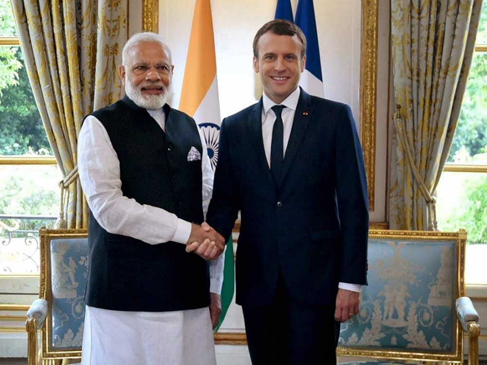 Prime Minister Narendra Modi meeting the President of France, Emmanuel Macron, in Paris on Saturday PTI Photo.
