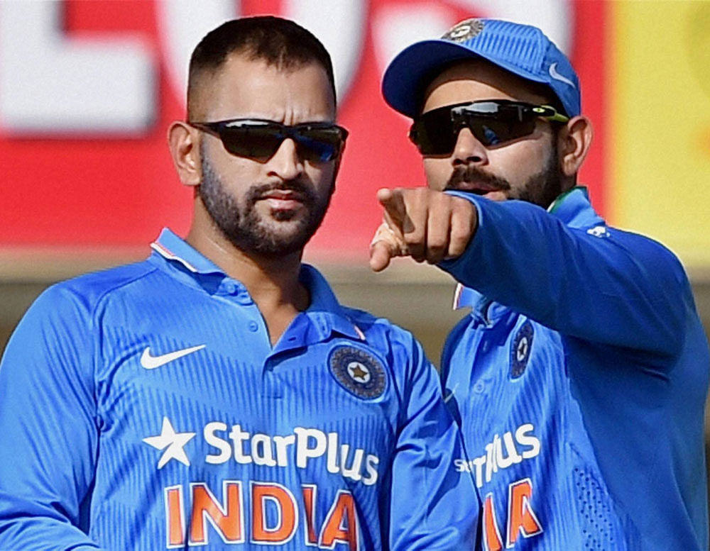 India skipper Virat Kohli says he may not agree with Mahendra Singh Dhoni on all aspects of the game but seeks the advise of his illustrious predecessor to make right decisions. File Photo