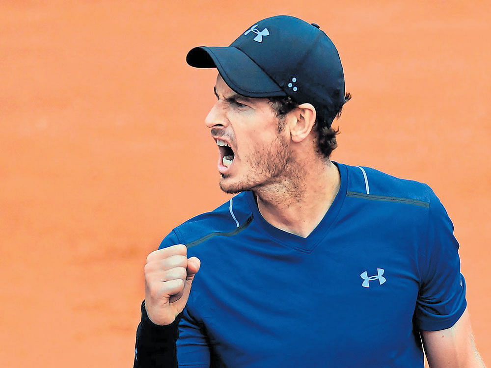 Victorious roar: Britain's World No 1 Andy Murray exults during his victory over Juan Martin del Potro on Saturday. AFP