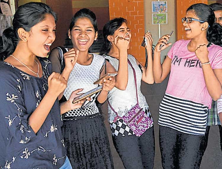 Students of Agragami Vidya Kendra Yelahanka  celebrate after the CBSE Class X results were declared on Saturday. DH  photo