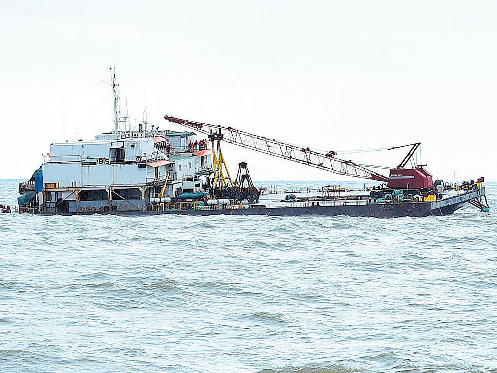 The barge with 27 people on board, which is sinking in the Arabian Sea off Ullal, Dakshina Kannada, on Saturday. DH photo