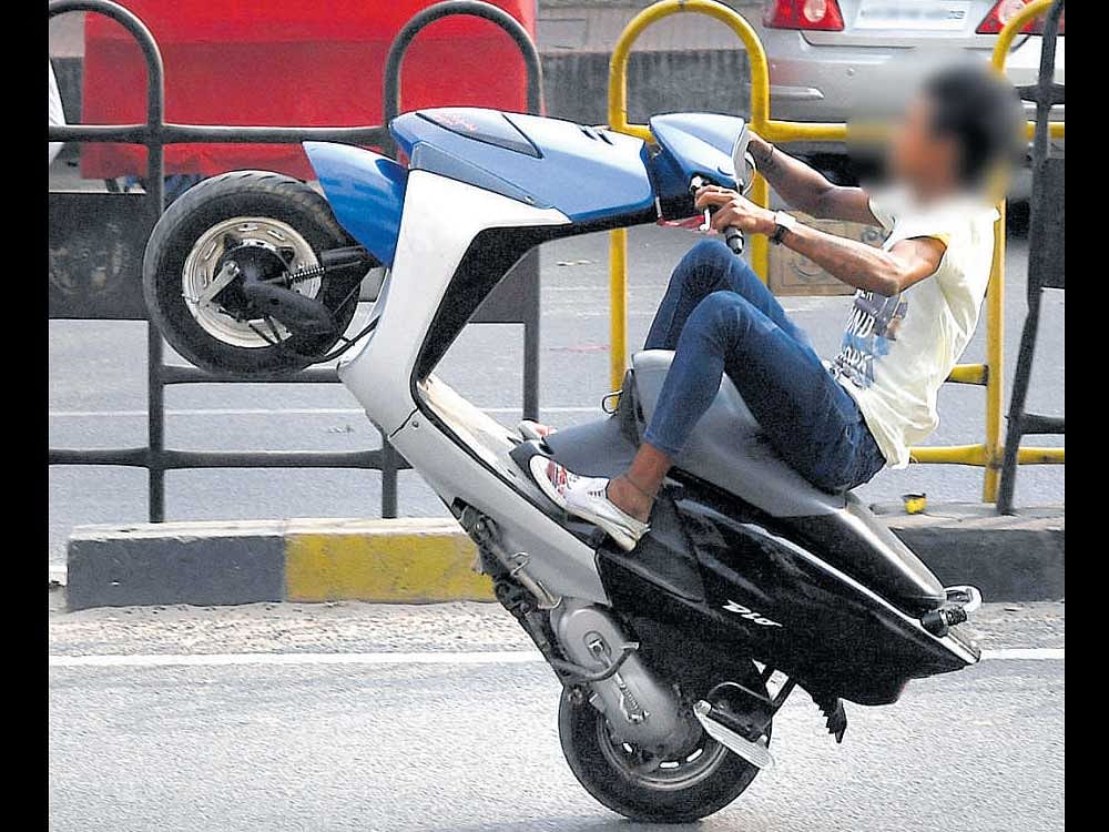 Police have begun registering FIRs against reckless driving, with riders, including minors, performing wheelies and  other stunts on the city roads. dh File photo