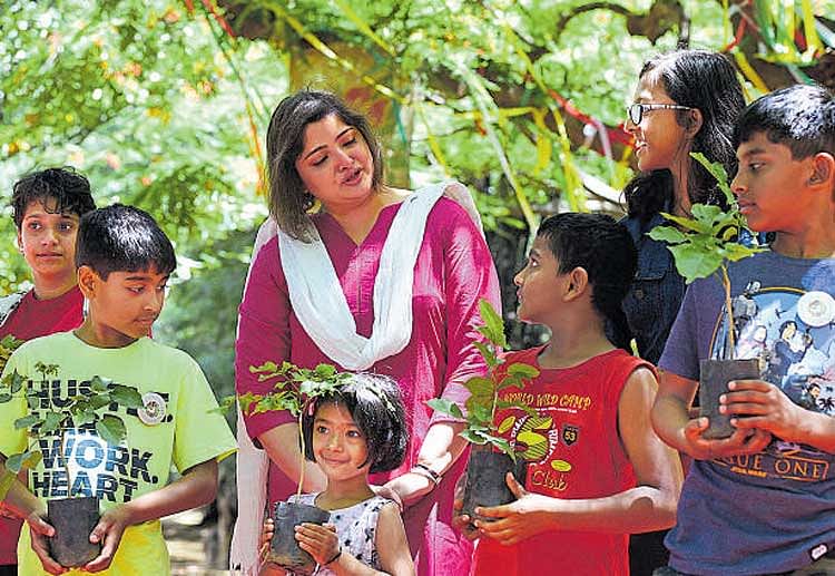 Actor Vasundhara Das interacts with children at 'Mara Habba' organised at the Cubbon Park on Saturday.