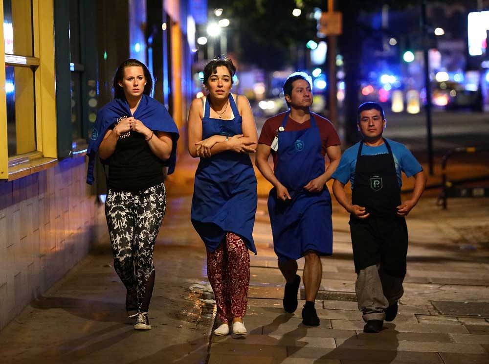 People leave the area after an incident near London Bridge in London, Britain June 4, 2017 REUTERS