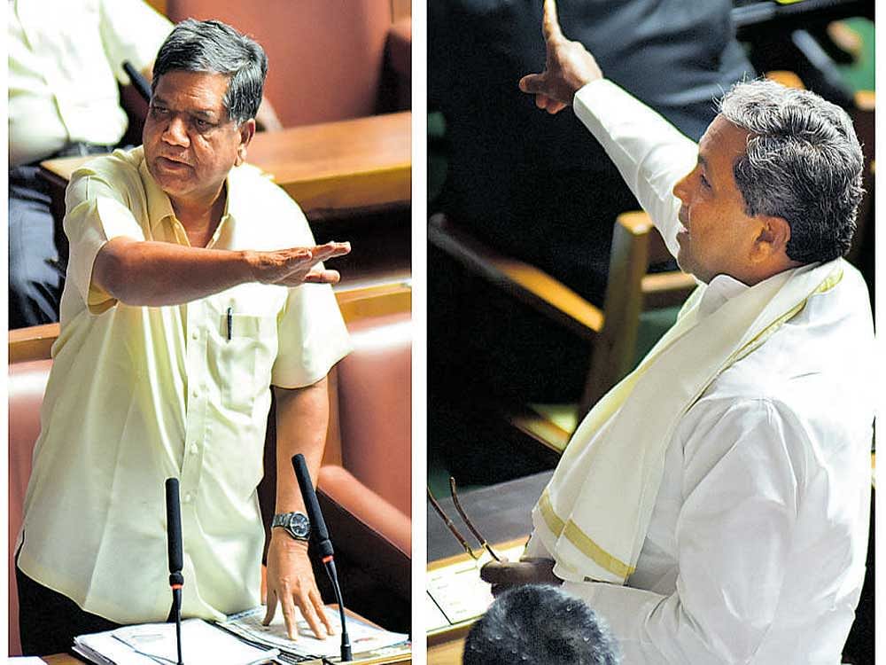 Opposition Leader Jagadish Shetter and Chief Minister Siddaramaiah arguing on 'Parjanya Japa' by water resources Minister M B Patil, during the Legislative Assembly Session at Vidhana Soudha in Bengaluru on Monday.  Dh Photo