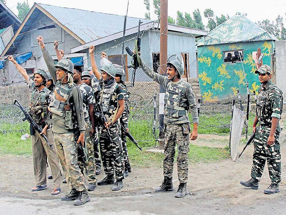celebratory mood: Security personnel rejoice the death of four suicide attackers at Sumbal area of north Kashmir's  Bandipora district on Monday. PTI