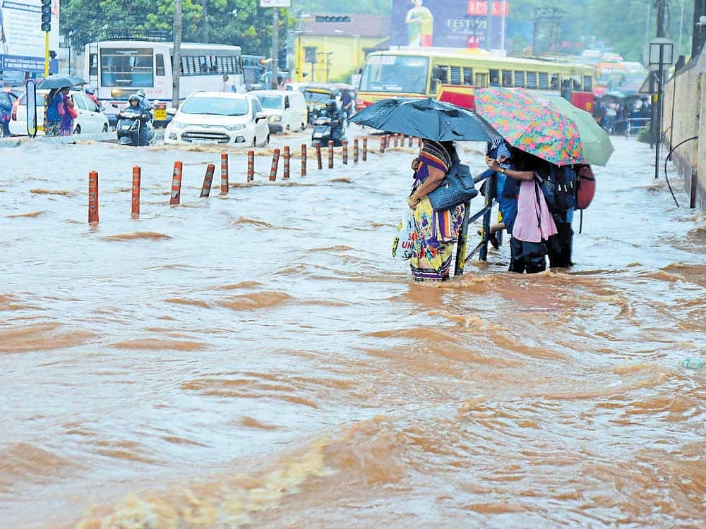 A waterlogged road, at Ambedkar Circle, Balmatta, in Mangaluru on Monday. DH photo