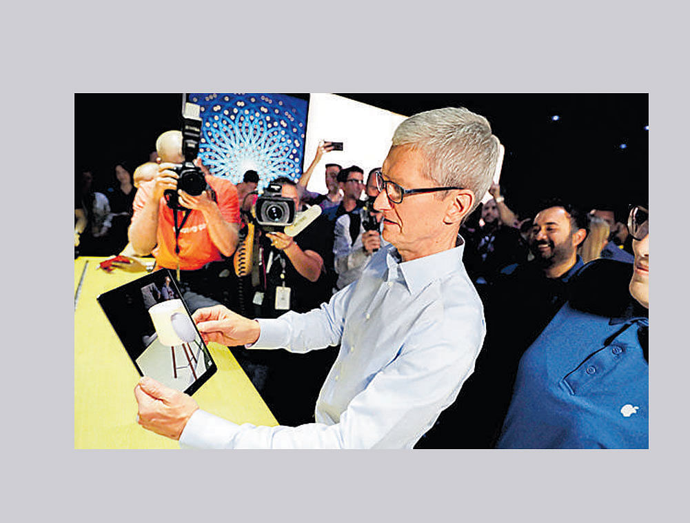 Apple CEO Tim Cook shows an iPad Pro at the Apple Worldwide Developers Conference in San Jose , California. AP/PTI