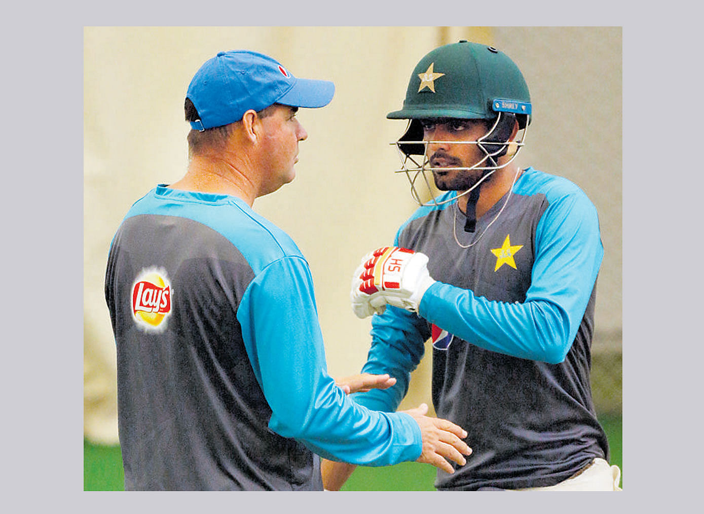 valuable tips Pakistan's coach Mickey Arthur (left) and Babar Azam during a nets session on Tuesday. AFP