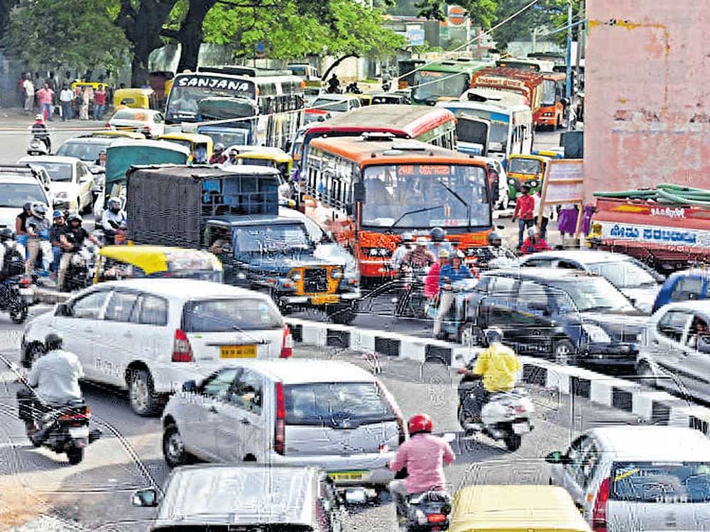 Slow moving traffic on the newly inaugurated railway  underpass at Okalipuram on Tuesday. DH Photo