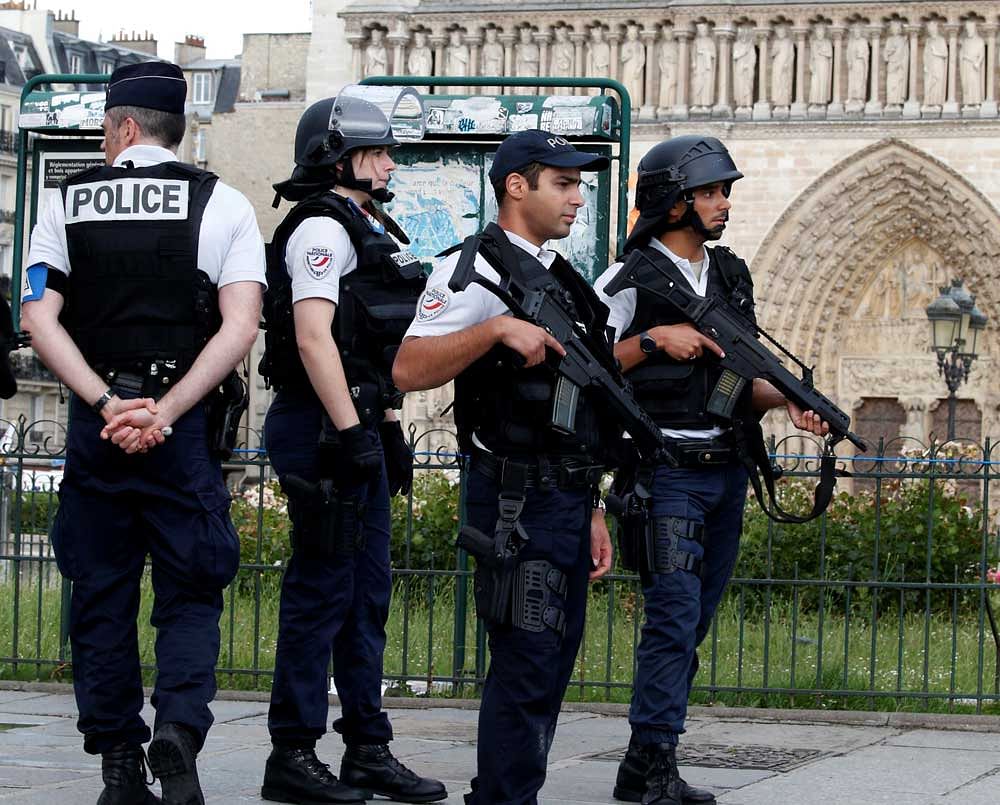 French police stand at the scene of a shooting incident near the Notre Dame Cathedral in Paris, France. Reuters Photo
