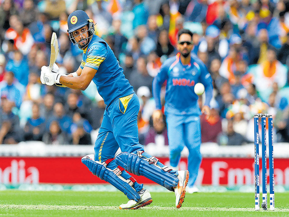 brilliant innings: Sri Lanka's Danushka Gunathilaka slams one to the fence en route to his 72-ball 76 against India at The Oval on&#8200;Thursday. Reuters