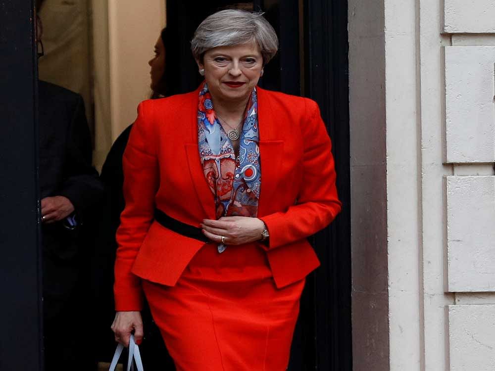 Britain's Prime Minister Theresa May leaves the Conservative Party's Headquarters after Britain's election in London, June 9, 2017. REUTERS