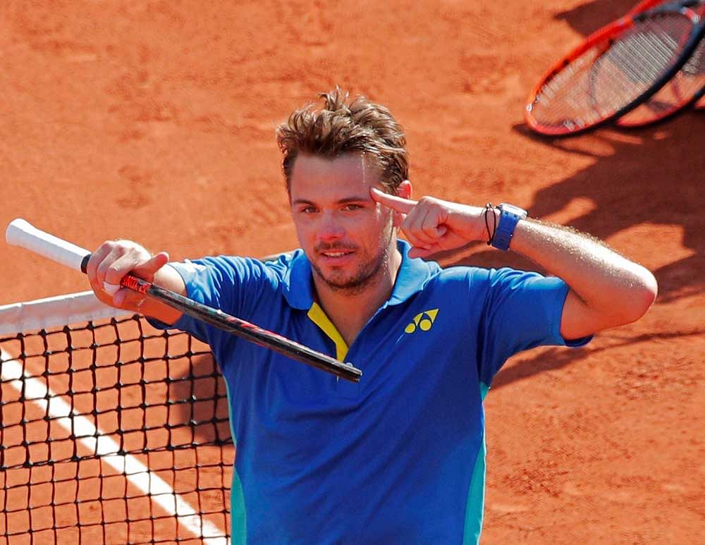 Switzerland's Stan Wawrinka celebrates winning his semifinal match of the French Open tennis tournament against =bam in five sets 6-7 (6-8), 6-3, 5-7, 7-6 (7-3), 6-1, at the Roland Garros stadium, in Paris, France. Friday, June 9, 2017. AP/PTI