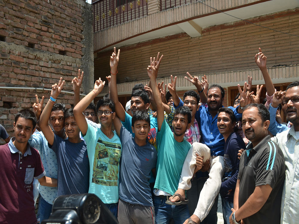 Successful students from Super 30 with its founder Anand Kumar in Patna on Sunday. Photo by Mohan Prasad.