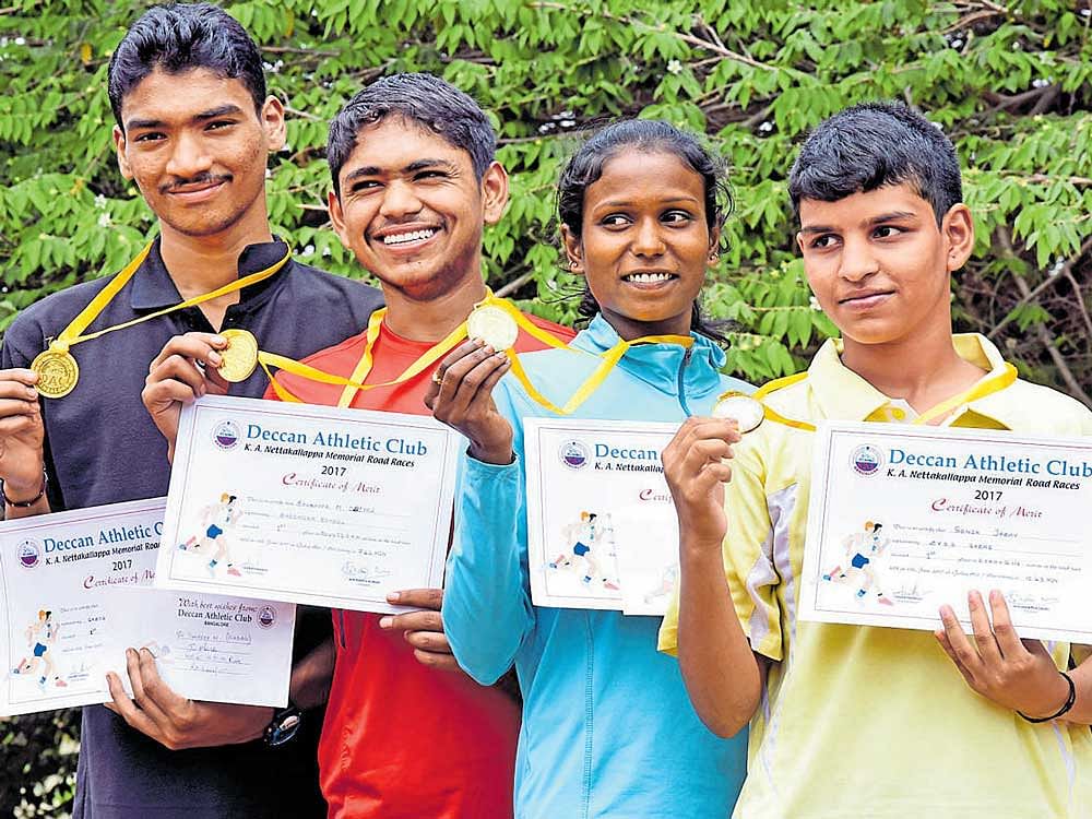 Winners of the K A Nettakallappa Memorial State-level Road Races, conducted by Deccan Athletic Club. From left: Sandeep N (men's 12 KM), Bannappa M Wodeyar (boys' U-16, 2.5 KM), Akshata A (women's 6 KM), Sonia Jadhav (girls U-16, 2.5 KM). DH PHOTO