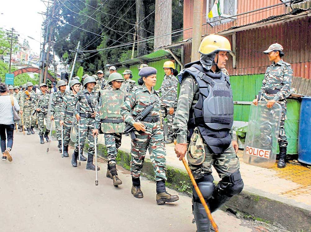 watchful: CRPF personnel patrol a street in violence-hit Darjeeling on Monday. PTI