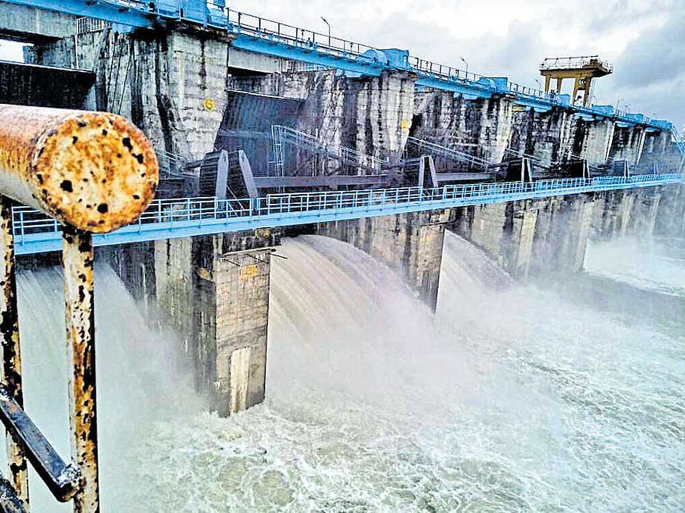 Water being released from all seven gates of Bennethora dam into the river following heavy rain in Kalaburagi  district on Tuesday. DH photo
