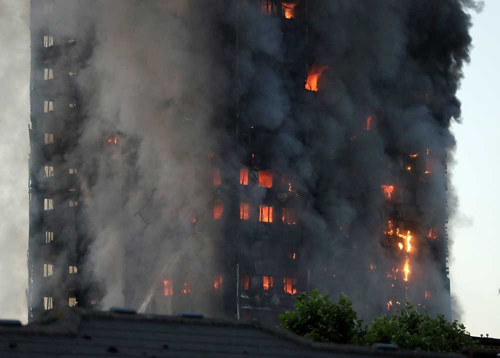 Smoke and flames rise from a building on fire in London, Wednesday, June 14, 2017. Metropolitan Police in London say they're continuing to evacuate people from a massive apartment fire in west London. The fire has been burning for more than three hours and stretches from the second to the 27th floor of the building.AP/PTI