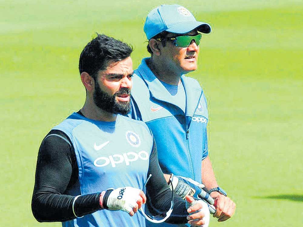 Master tacticians: Indian skipper Virat Kohli (left) and coach Anil Kumble during a training session on Wednesday. AP/PTI