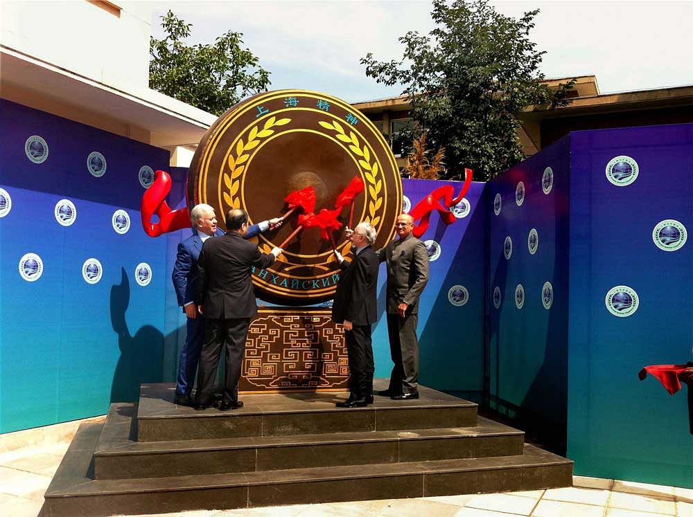Indian Ambassador to China Vijay Gokhale (extreme right) along with his Pakistan counterpart Masood Khalid, Chinese Assistant Foreign Minister Kong Xuanyou, Secretary General of Shanghai Cooperation Organisation (SCO) General Rashid Alimov, beating the drum heralding the admission of India and Pakistan as new members of the SCO at its headquarters in Beijing on Thursday. PTI Photo