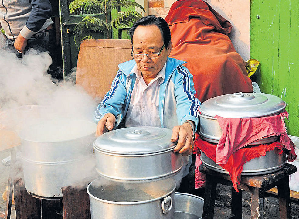 A man setting up breakfast in Kolkata's Old Chinatown. Photo BIJOY CHOWDHURY.