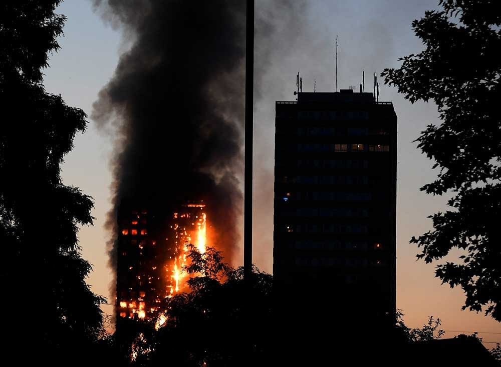 The freak fire englufed most of the upper portion of the tower, killing 58 people by the time firefighters could douse it. Photo credit: reuters.